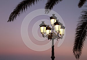 Beautiful warm light of a lantern. Evening city.