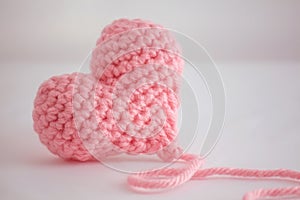 Beautiful warm pink crocheted heart - closeup