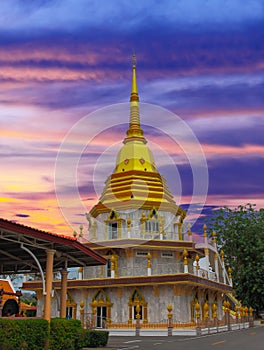 Beautiful Wat Buddhist temples in Phuket Thailand. Decorated in beautiful ornate colours of red and Gold and Blue. Lovely sunset