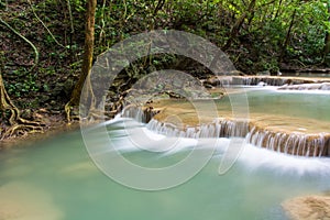 Beautiful water fall on a rock in Thailand, Erawan waterfall at