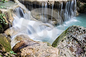 Beautiful water fall on a rock in Thailand, Erawan waterfall at