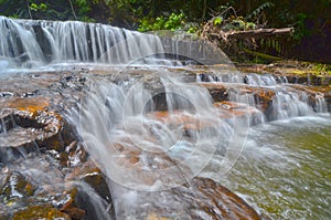 A beautiful scenery of Atas Pelangi Waterfall in Pahang, Malaysia photo