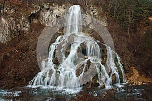 Beautiful Waterfall in autumn in Caras-Severin county, Romania. Beautiful long exposure Carsa waterfall in autumnal landscape