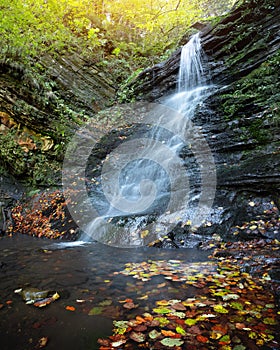 Beautiful waterfall on autumn forest