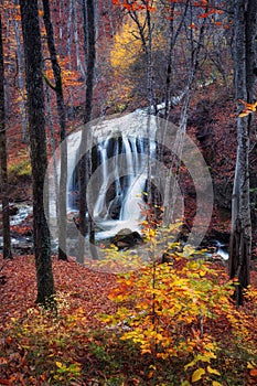 Beautiful waterfall in autumn forest in crimean mountains at sun