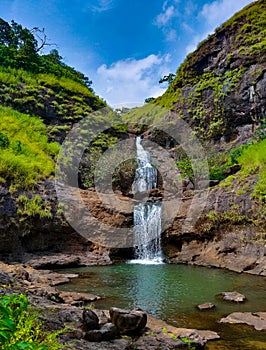 Beautiful waterfall with blue sky in the background. Waterfall in Sahyadri mountains.