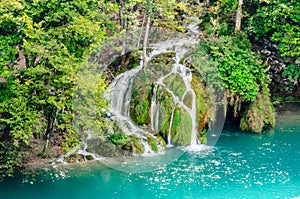 Beautiful Waterfall Cascade in Plitvice Lakes National Park, Croatia. Green Natural Environment with Waters Falling into the Lake