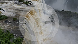 Beautiful waterfall. Close-up. Streams collapse from the edge of the ledge