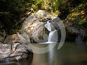 Beautiful waterfall in Covasna County framed by green moss and vegetation