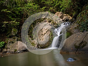 Beautiful waterfall in Covasna County framed by green moss and vegetation