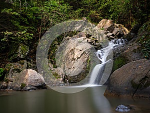 Beautiful waterfall in Covasna County framed by green moss and vegetation