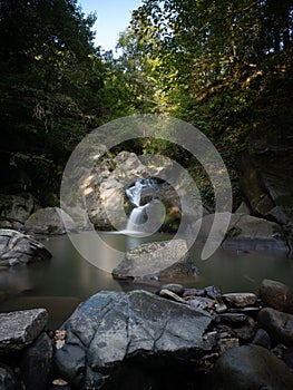 Beautiful waterfall in Covasna County framed by green moss and vegetation