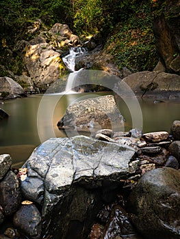 Beautiful waterfall in Covasna County framed by green moss and vegetation