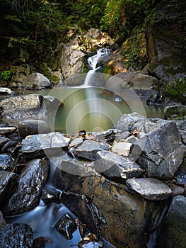 Beautiful waterfall in Covasna County framed by green moss and vegetation