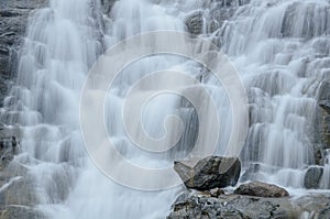 Beautiful waterfall falling on the steps