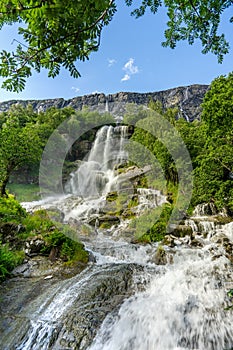 Beautiful waterfall flowing down a mountainside in Norway