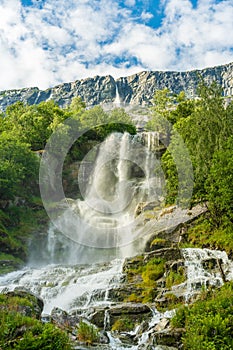 Beautiful waterfall flowing down a mountainside in Norway