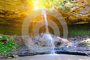 Beautiful waterfall in the forest and sun