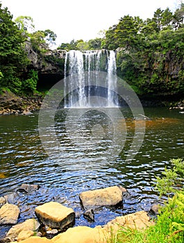 Beautiful waterfall with greenery in New Zealand.