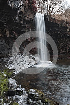 Beautiful waterfall landscape image in forest during Autumn Fall