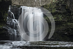 Beautiful waterfall landscape image in forest during Autumn Fall