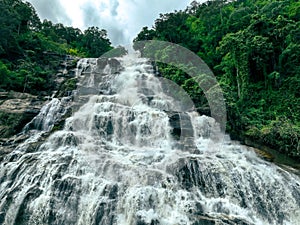 Beautiful waterfall in lush tropical green forest. Nature landscape. Mae Ya Waterfall is situated in Doi Inthanon National Park,