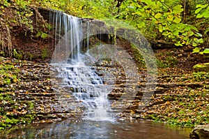 Beautiful waterfall on a mountain stream in the woods