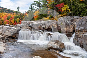 Beautiful waterfall in the mountains in autumn photo