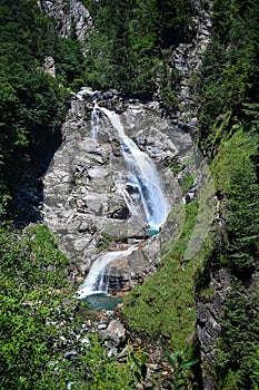 Beautiful waterfall in the mountains. Scenic valley in Austria