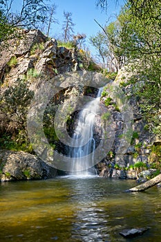 Beautiful waterfall in Penedo Furado Passadico walkway in Vila de Rei, Portugal photo