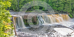 Beautiful waterfall at Porcupine Mountains Wilderness State Park in the Upper Peninsula of Michigan - smooth tranquil flowing wate photo