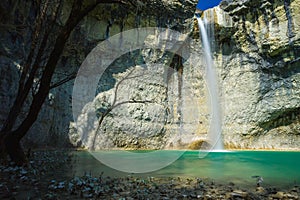 Beautiful waterfall Sopot in the cave with a turquoise lake in Istria, Croatia photo