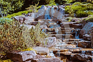 Beautiful waterfall in the statue gardens at the Frederik Meijer Gardens