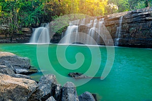 Beautiful waterfall with sunlight in jungle. Sri Dit Waterfall