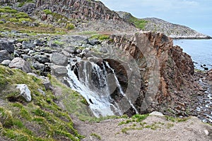 Beautiful waterfall in Teriberka. Arctic, Russia