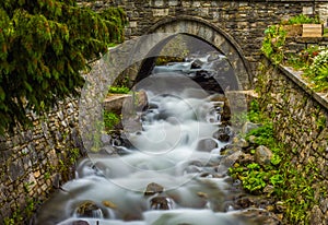 Beautiful waterfall under a bridge