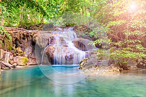 Beautiful waterfall in wild rainforest in Erawan National park, Thailand