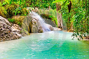 Beautiful waterfall in wild rainforest in Erawan National park, Thailand