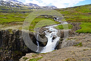Beautiful waterfalls on the mountain near Seydisfjordur, Iceland during the summer
