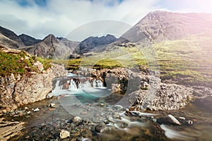 Beautiful waterfalls scenery on the Isle of Skye, Scotland: The Fairy Pools, Glen Brittle, Scotland. Sunshine