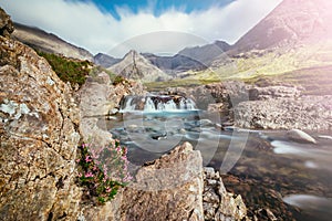 Beautiful waterfalls scenery on the Isle of Skye, Scotland: The Fairy Pools, Glen Brittle, Scotland. Sunshine