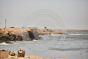 The beautiful waters of the Atlantic ocean with its rocky coastline near the City of Dakar in Senegal photo