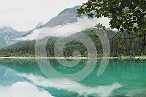 Beautiful waterscape on lake Jagersee on a foggy sommersday