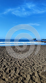 Beautiful Watu Ulo beach with black sand