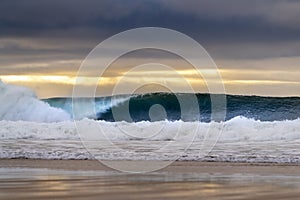 Beautiful wave breaking at the Carcavelos Beach