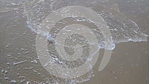 Beautiful waves in the beach with sand