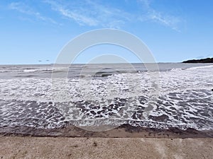 Beautiful waves during the day on the shoreline of Anyer, Indonesia