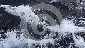 Beautiful waves from moving boat. Clip. Splashes of waves from moving sea boat. Beautiful waves moving sideways from