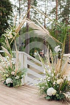 Beautiful wedding arch on the background of the lake