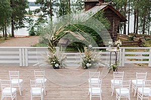 Beautiful wedding arch on the background of the lake